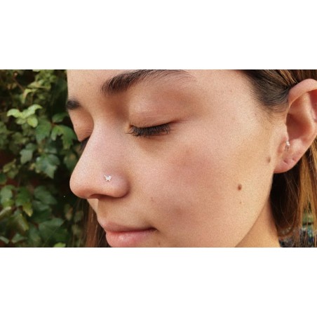 Piercing punto mariposa